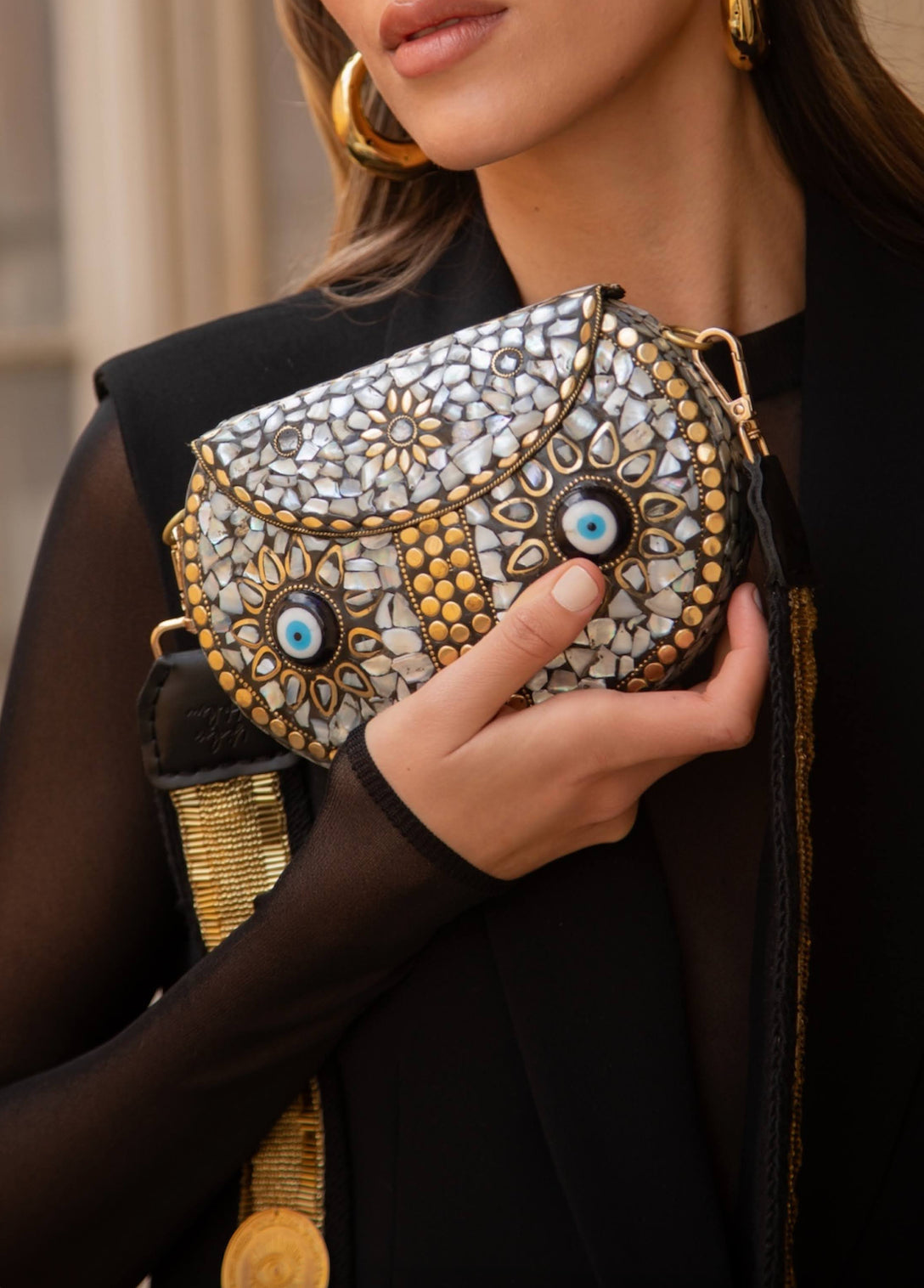 OCCHI CLUTCH BAG