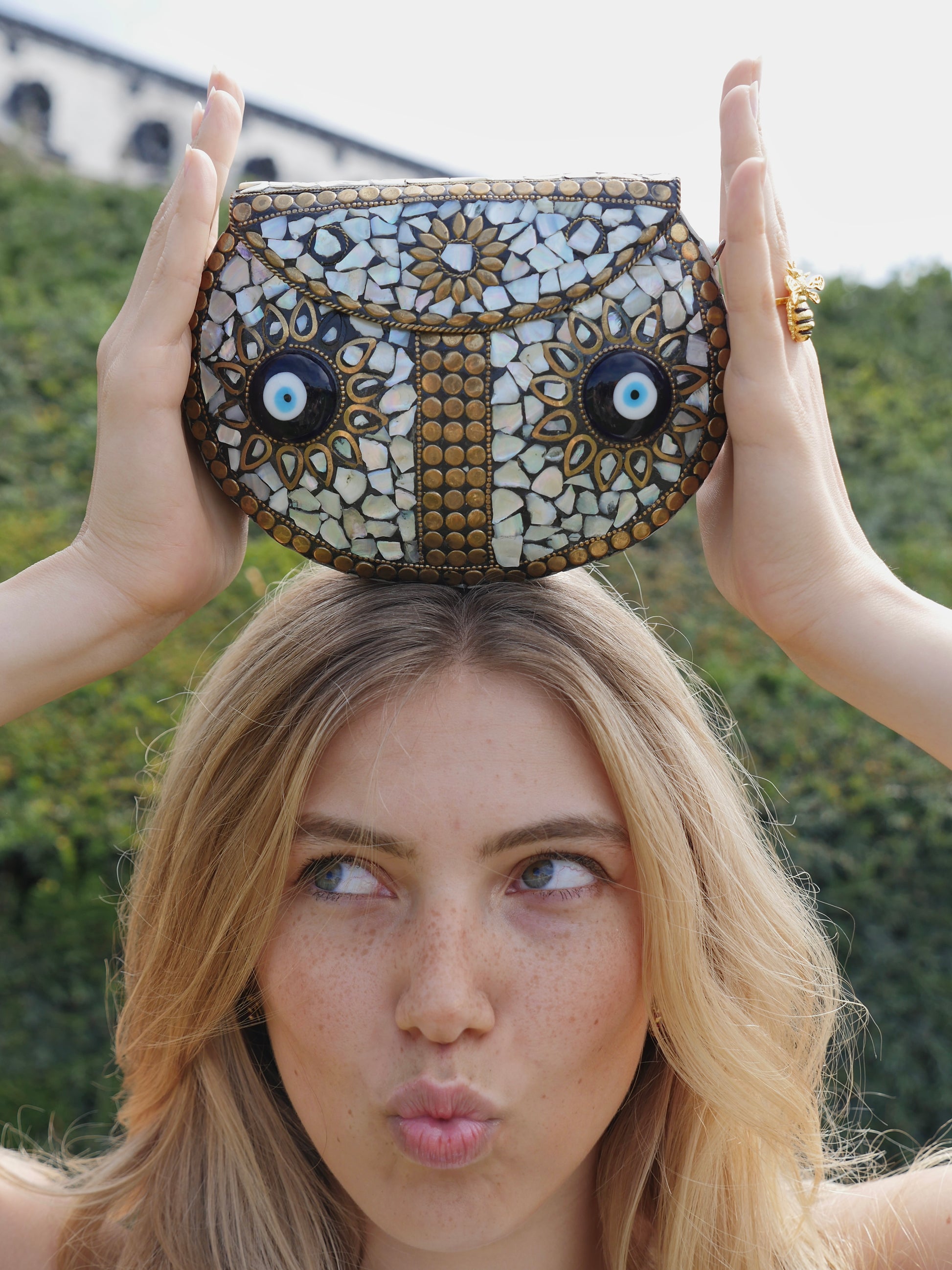 OCCHI CLUTCH BAG